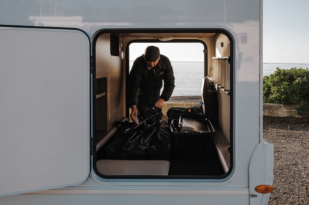 man organising garage storage