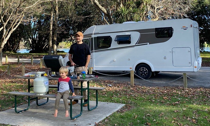 Family cooking on gas BBQ