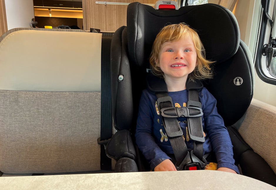 Kid in a motorhome seat having fun