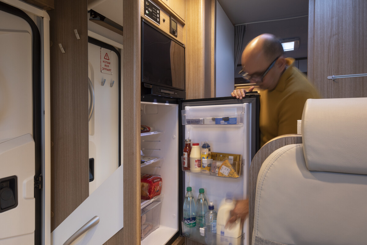 Opening-fridge-inside-motorhome