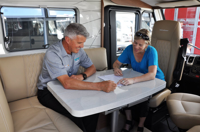 SmartRV staff with a customer inside a motorhome