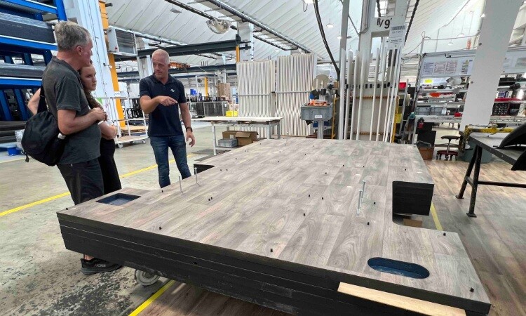 A Carado employee explaining about the Carado motorhome flooring system
