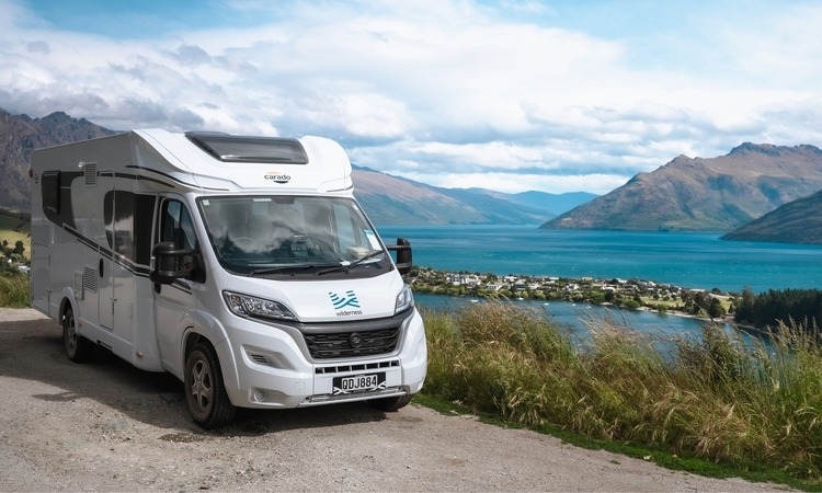 A Carado motorhome parked with a scenic view