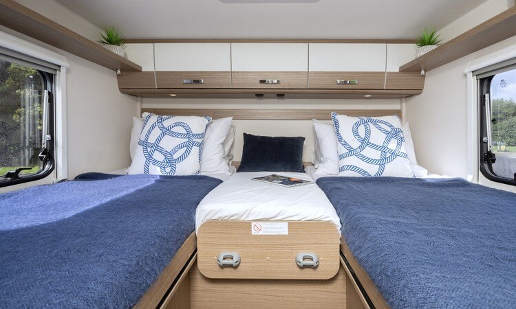 The twin bed set up in a Carado T447