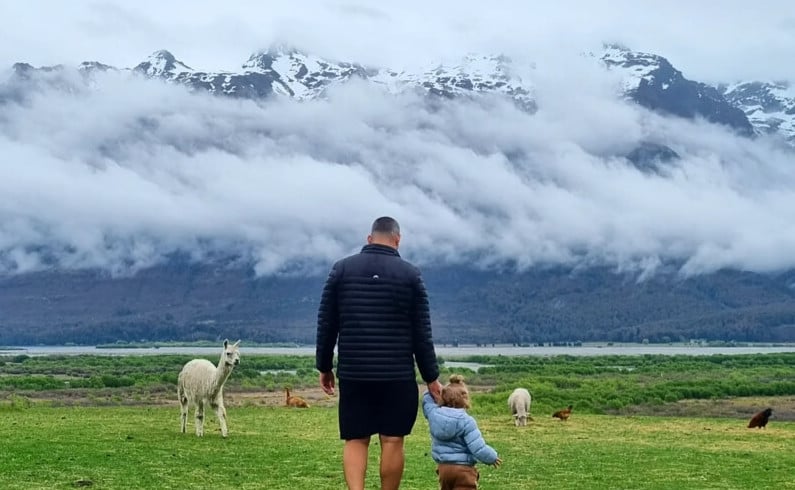 Toddler outside in a sheep farm