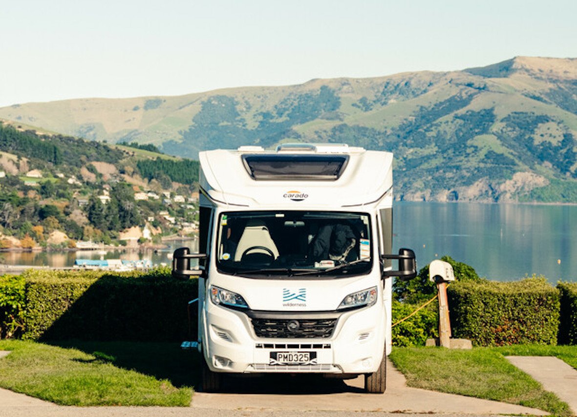 Motorhome parked up recharging the house battery in a campground