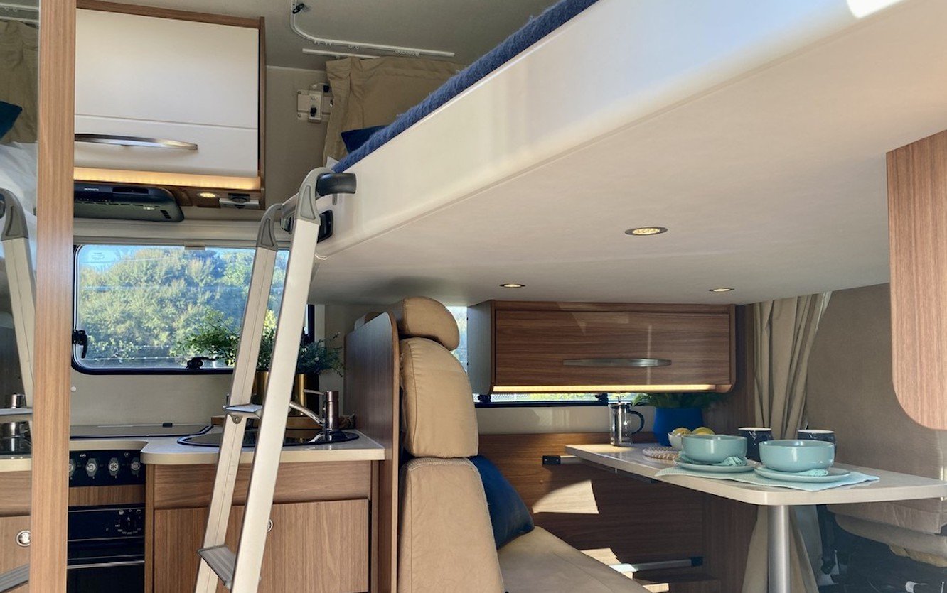 Carado motorhome's interior drop down bed with a ladder