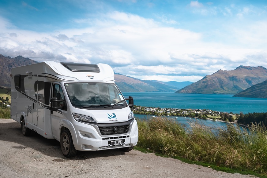 A motorhome parked beside a scenic view