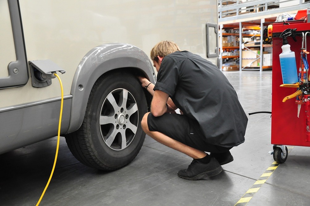 mechanic checking tyres