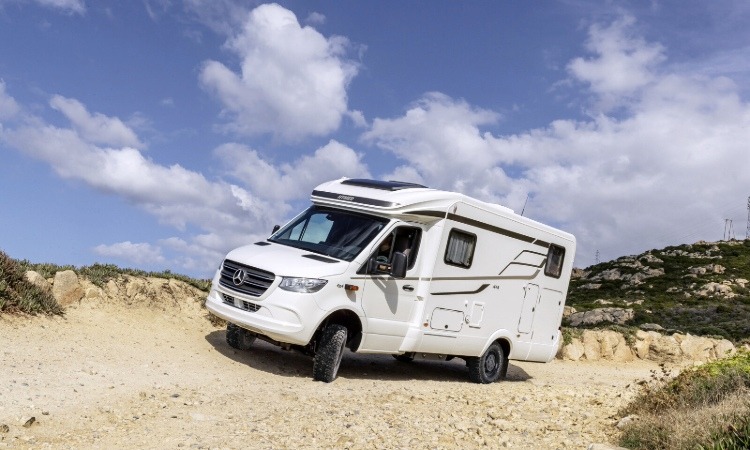 A four wheel drive motorhome driving off road