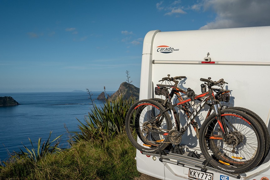 Storing bikes on bike racks behind motorhome