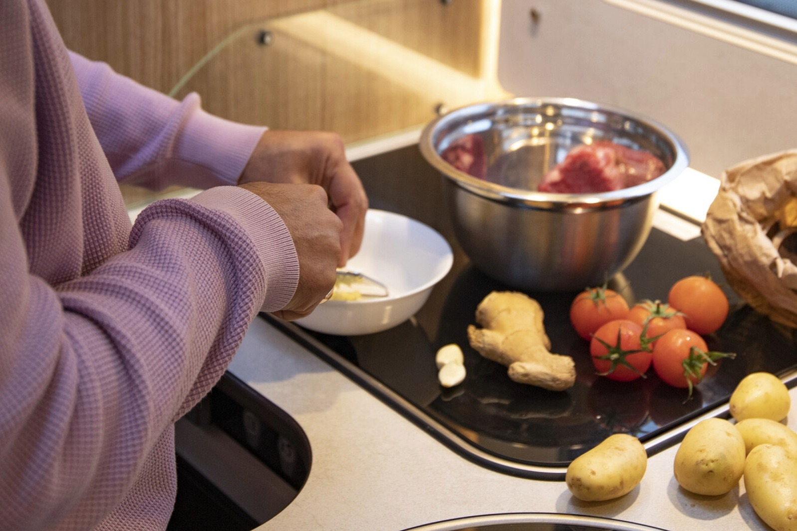 Preparing to cook in a motorhome kitchen