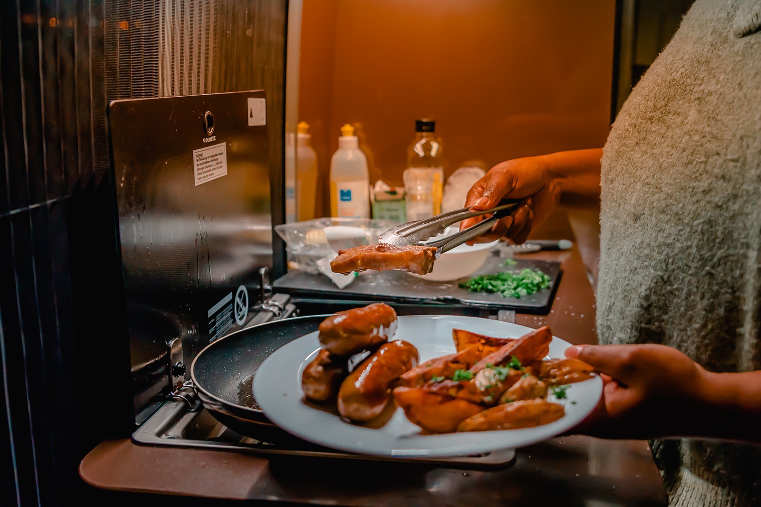 Cooking dinner at night in a motorhome