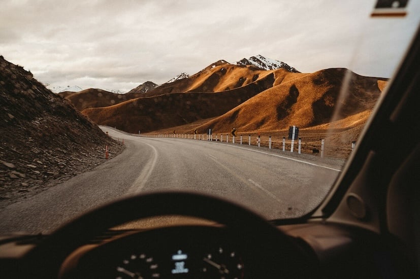 Driving a motorhome through the mountains with snow