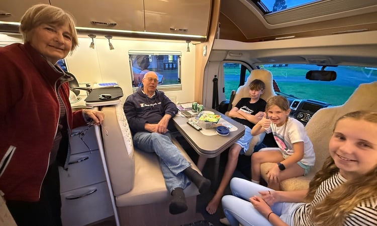 Anne and Roger with grandchildren