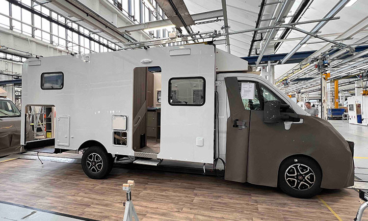 A motorhome being constructed in a factory