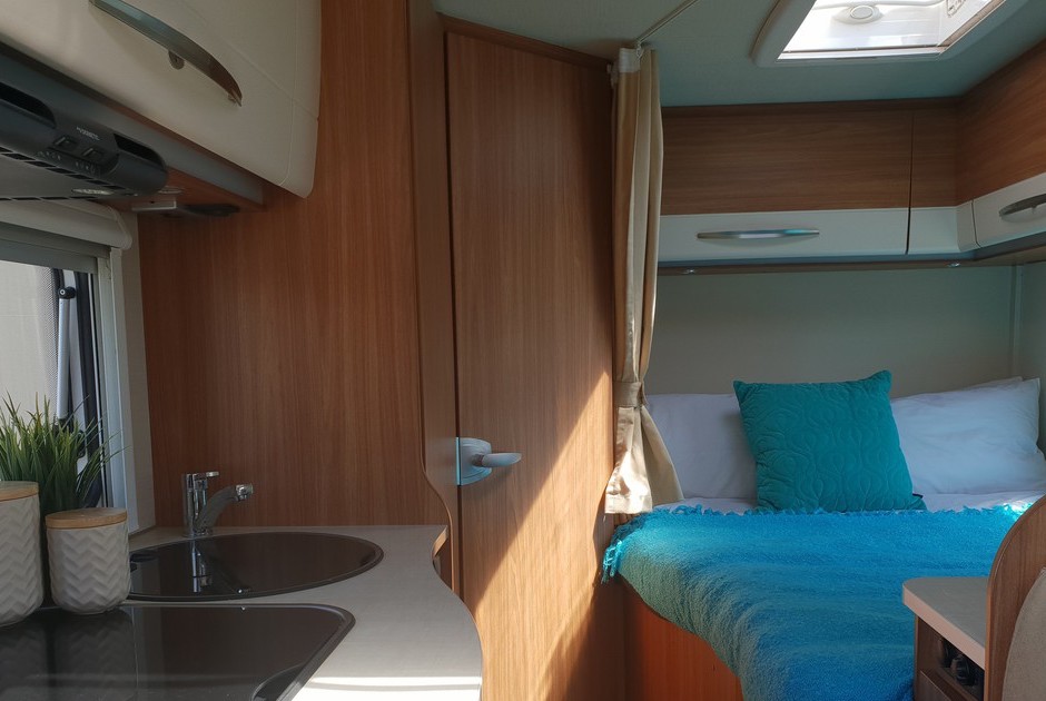 Wilderness 2017 Carado T135 motorhome interior kitchen and bed