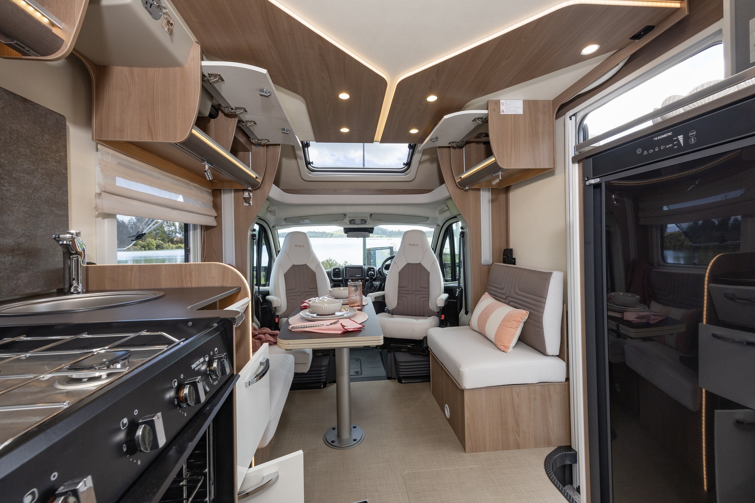 Wilderness 2025 Lyseo TD727 motorhome interior rear to front cupboards open