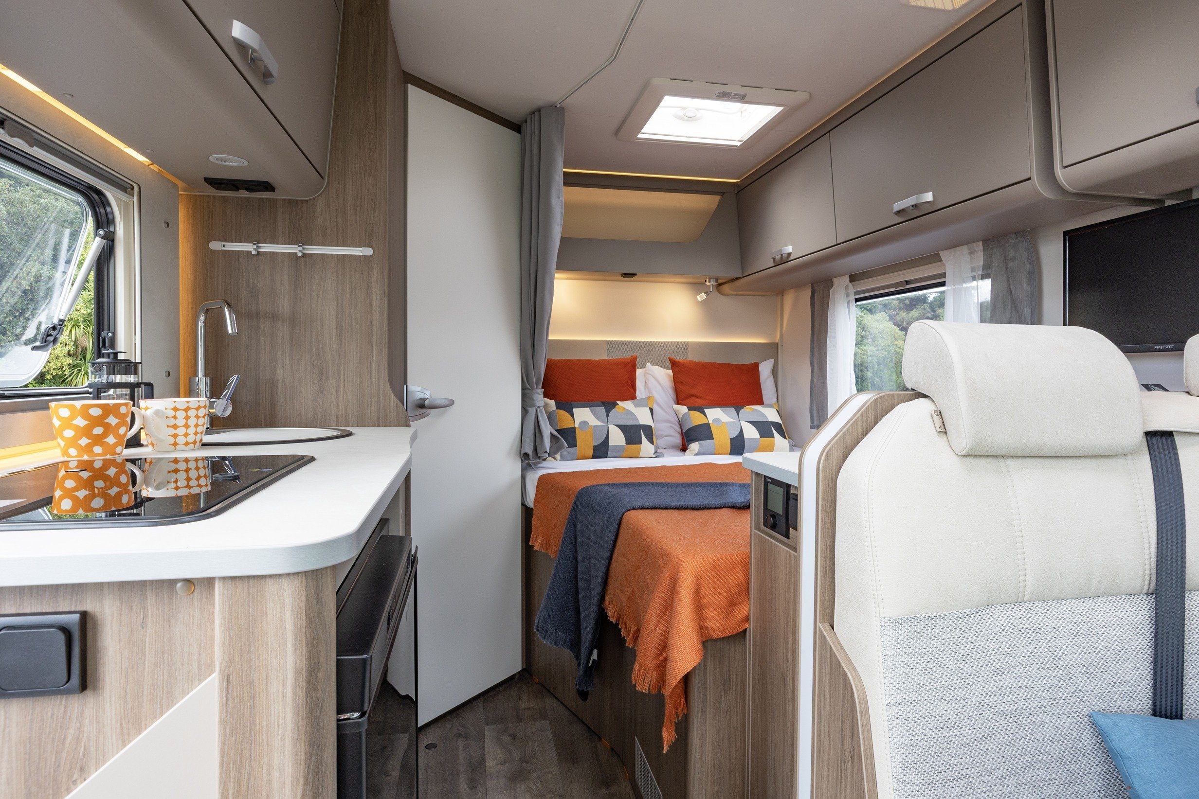 Wilderness 2025 Carado T135 motorhome interior bedroom and living