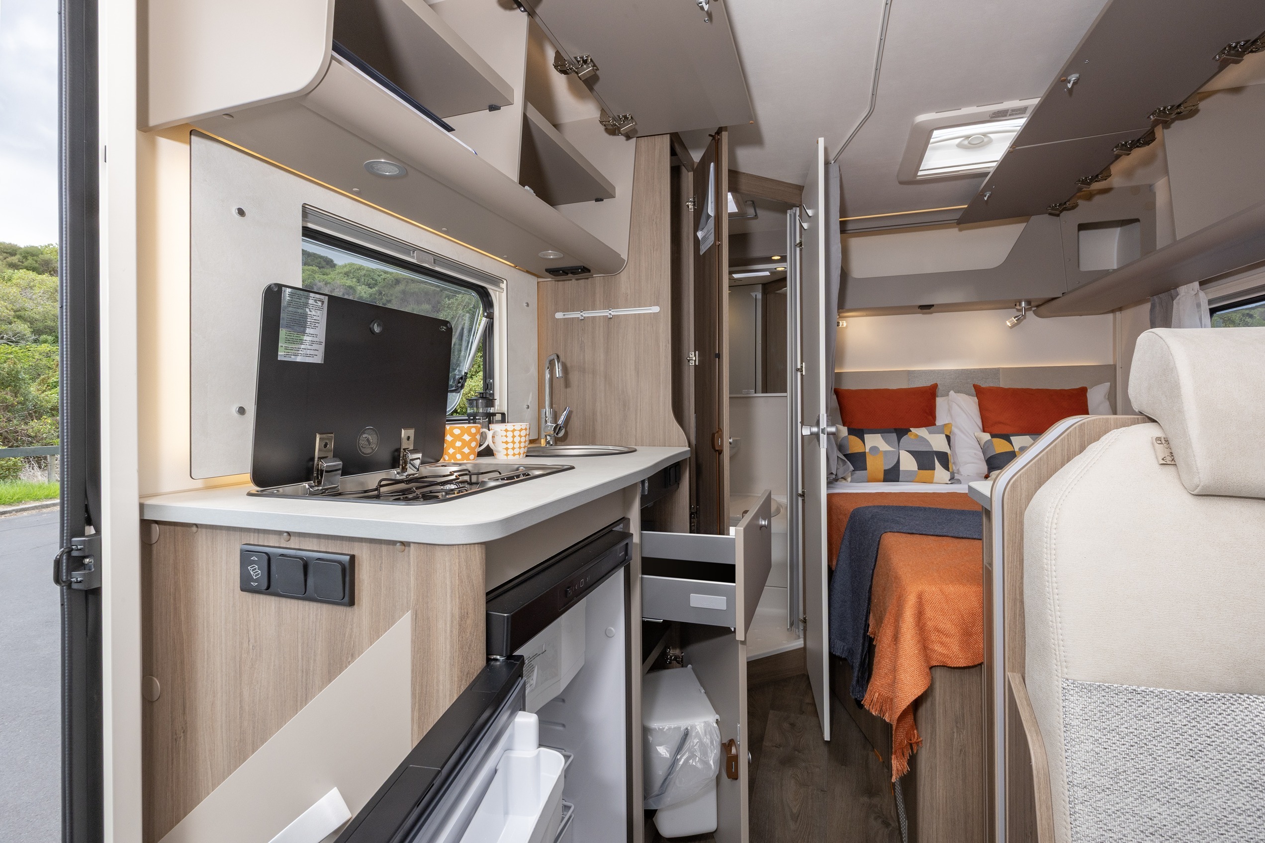 Wilderness 2025 Carado T135 motorhome interior kitchen draws open