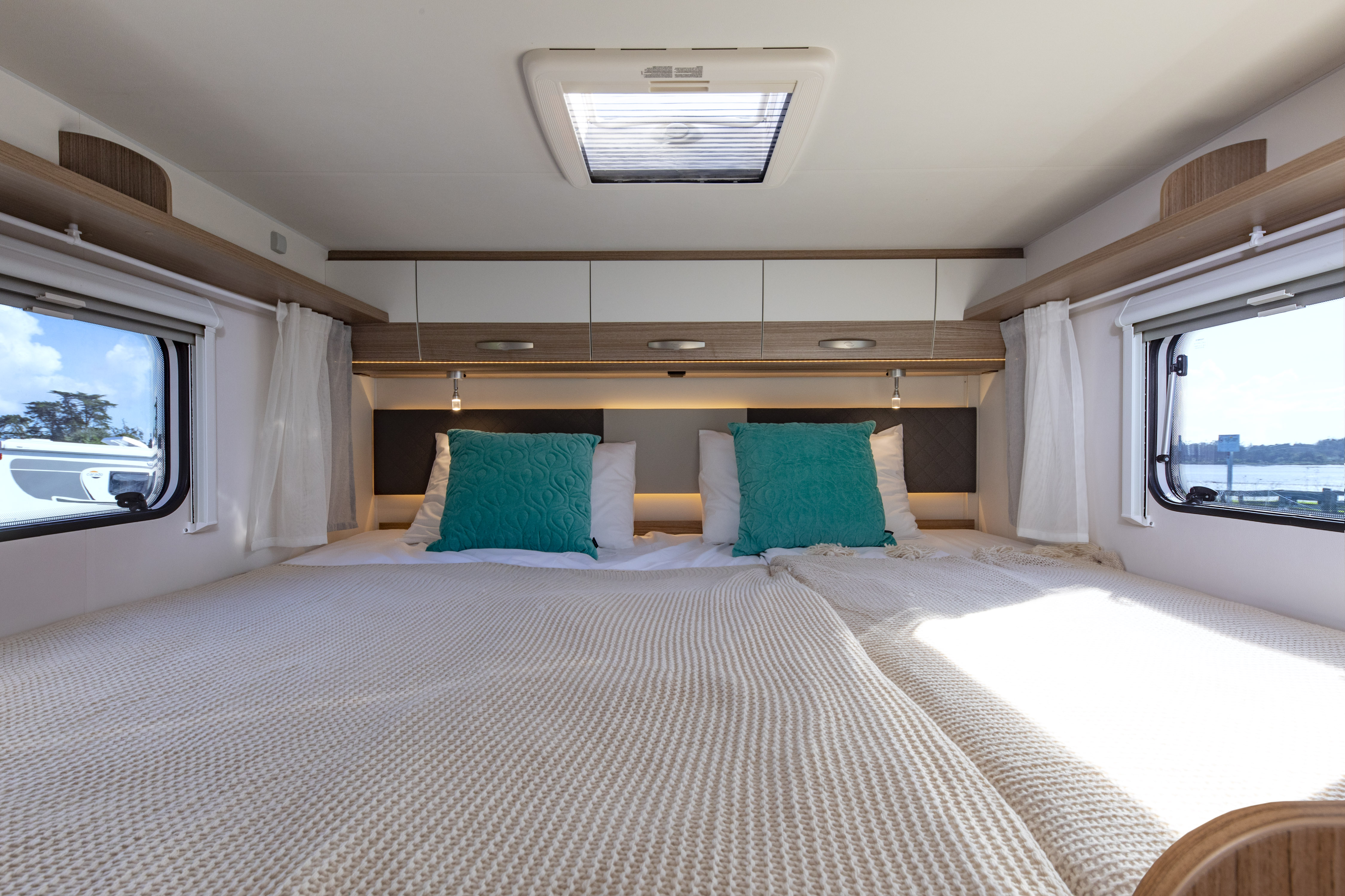 Wilderness 2022 Carado T447 motorhome interior king bed setup